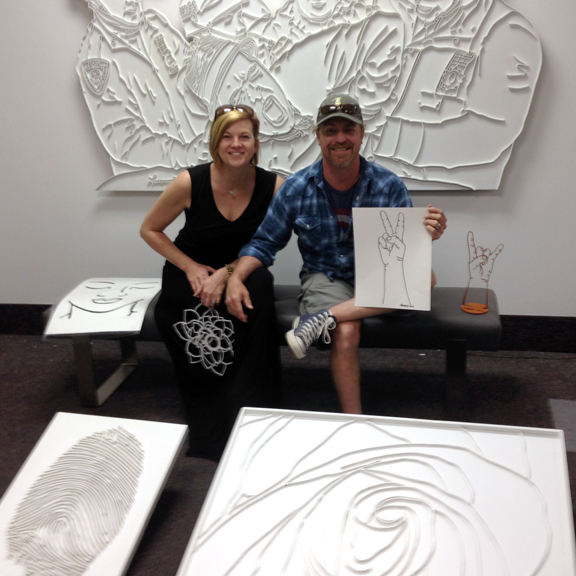Heather and Marty Satterfield with their art purchases